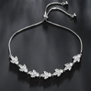 Pulseira Florescer - banhada a ouro amarelo ou platina com zircônias em forma de flores