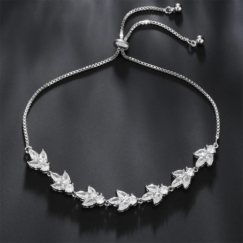 Pulseira Florescer - banhada a ouro amarelo ou platina com zircônias em forma de flores