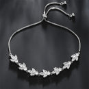 Pulseira Florescer - banhada a ouro amarelo ou platina com zircônias em forma de flores