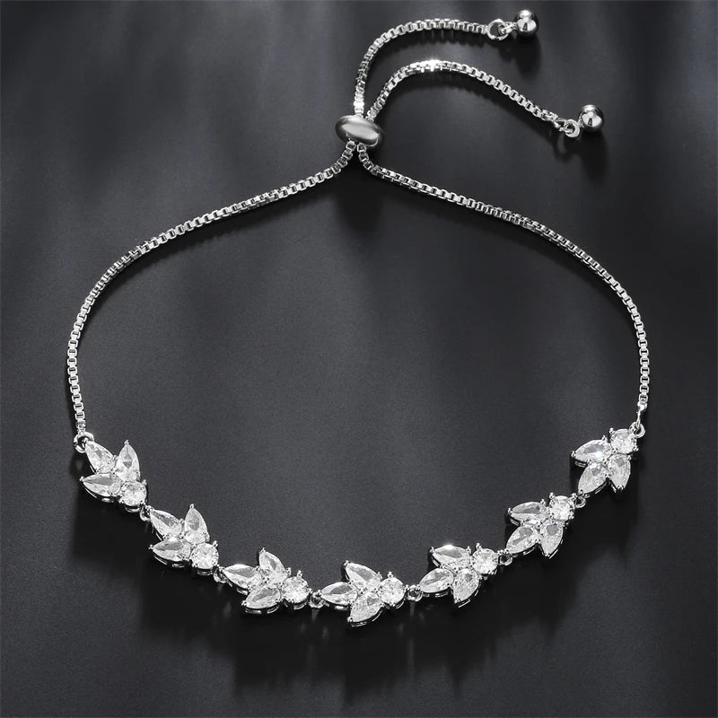 Pulseira Florescer - banhada a ouro amarelo ou platina com zircônias em forma de flores