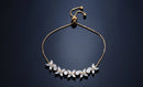 Pulseira Florescer - banhada a ouro amarelo ou platina com zircônias em forma de flores