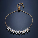 Pulseira Florescer - banhada a ouro amarelo ou platina com zircônias em forma de flores